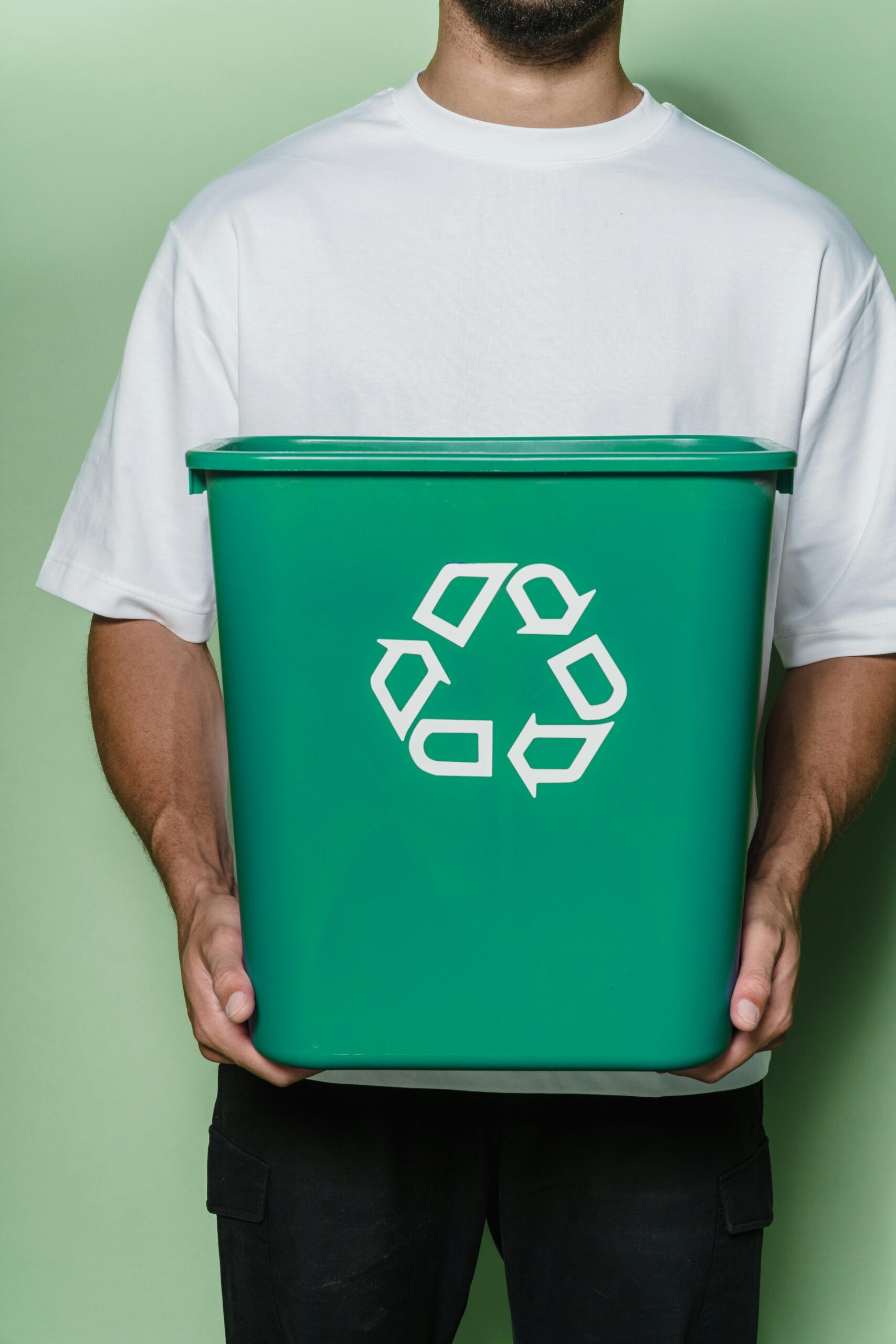 Source: https://www.pexels.com/photo/man-in-white-t-shirt-holding-green-box-9324359/